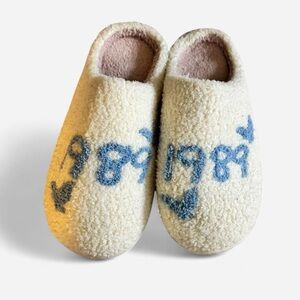 Cozy Cream Slippers with Blue and Black Design
